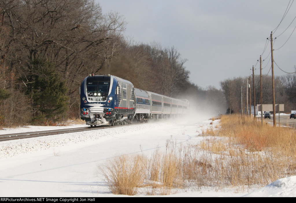 Quickly accelerating away from its station stop, 4622 leads the Blue Water  west